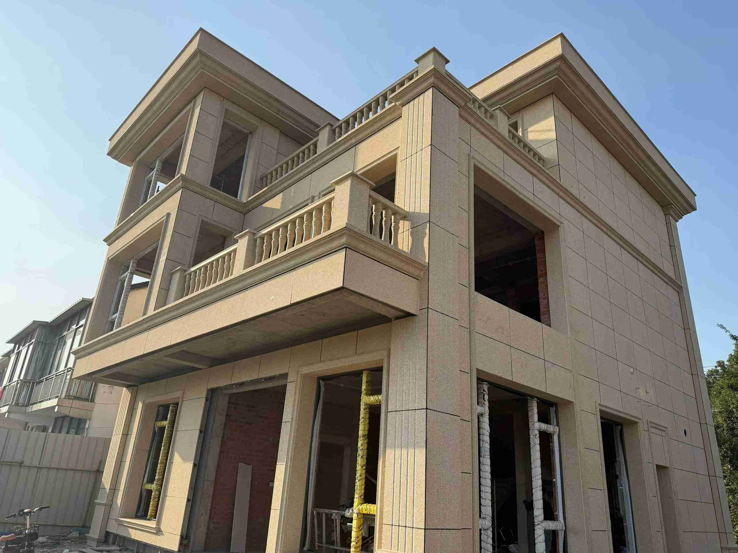 克拉玛依 黄金麻花岗岩石材荔枝面外墙干挂效果展示